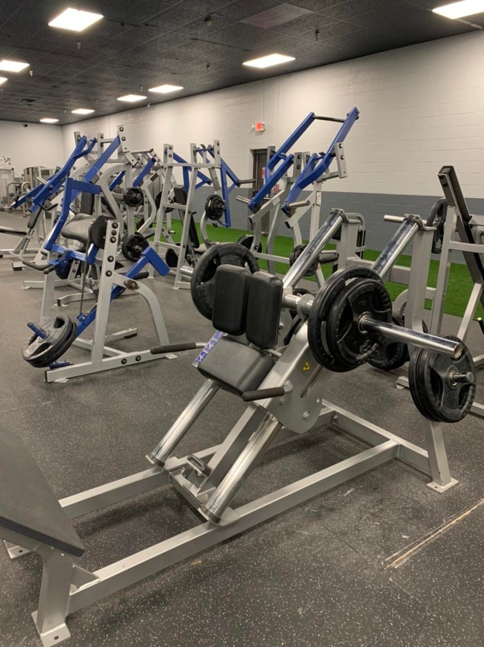 Free weight rack and dumbbells at Unlimited Fitness LLC