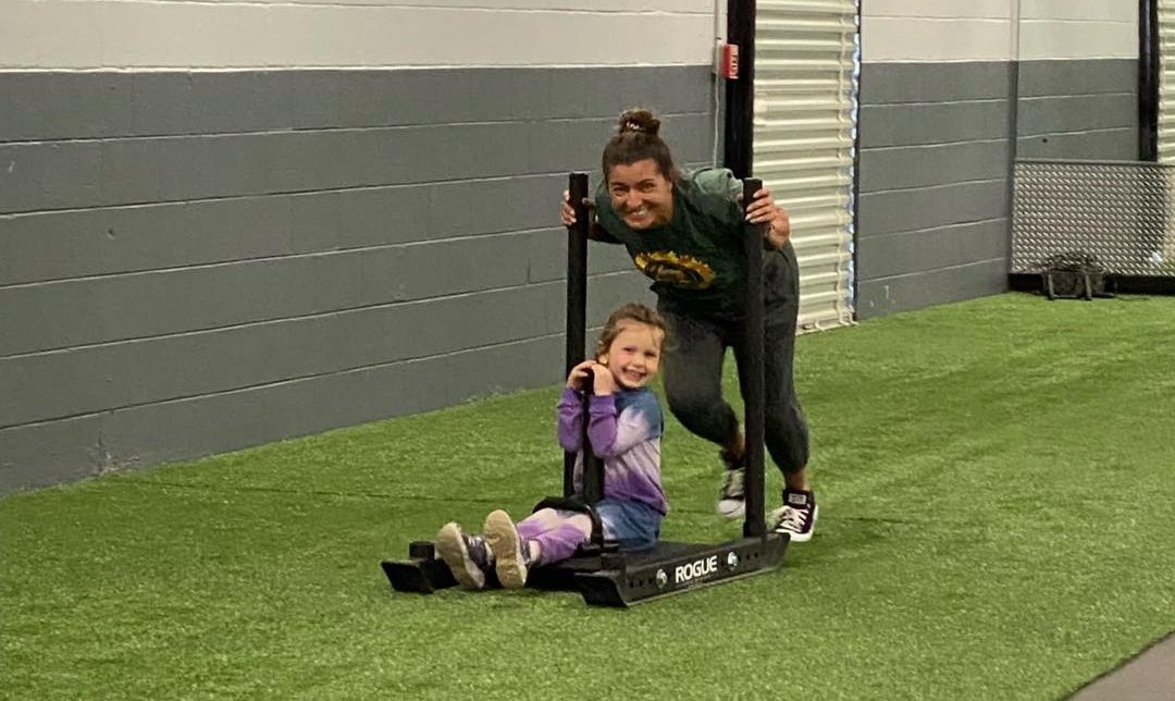 Sled push on the turf training area